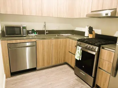 a kitchen with a stove and a microwave at 3 bedroom Home Casa Serenity Central Los Angeles in Los Angeles