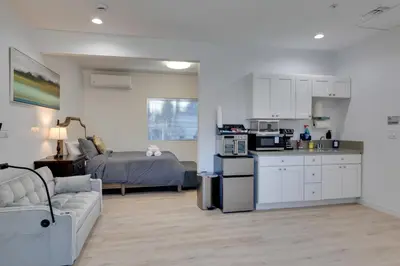 a kitchen and living room with a couch and a bed at 4 Mi to Old Pasadena Walkable Studio in Alhambra
