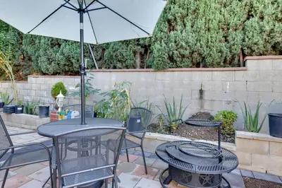 a patio with a table and chairs and an umbrella at 4 Mi to Old Pasadena Walkable Studio in Alhambra