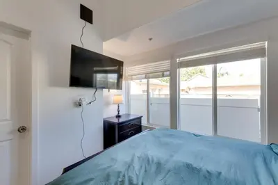 a bedroom with a bed and a tv on a wall at Walk to Main St! Pet-Friendly Alhambra Studio in Alhambra