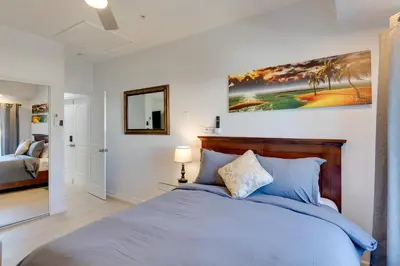 a bedroom with a bed and a mirror at 2 Blocks to Main St Foodies Paradise in Alhambra in Alhambra