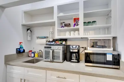 a kitchen with white cabinets and a counter top at 2 Blocks to Main St Foodies Paradise in Alhambra in Alhambra