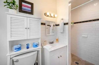 a white bathroom with a toilet and a sink at Remodeled Chick Studio Near Downtown LA, AC, WiFI, WD, Snack in Los Angeles