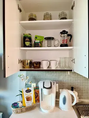 a kitchen counter with a coffee maker and other kitchen items at Stylish Studio in Mid-Wilshire with Pool, Free Parking, Gym in Prime Location in Los Angeles