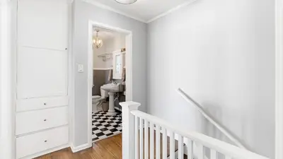 a white bathroom with a toilet and a sink at Cozy Hollywood Hideaway w Private Patio Easy City Access Casa Camrose by AvantStay in Los Angeles
