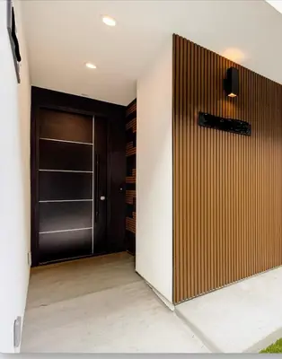 a walk in closet with a wooden door at Platinum Suite LA in Los Angeles