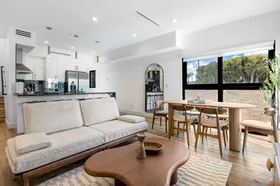 a living room with a couch and a table at Platinum Suite LA in Los Angeles