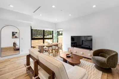 a living room with a couch and chairs and a table at Platinum Suite LA in Los Angeles