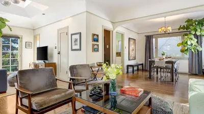a living room with chairs and a table at Spanish Revival Charm in Silver Lake w Patio BBQ Walkable Location Maltman Manor by AvantStay in Los Angeles
