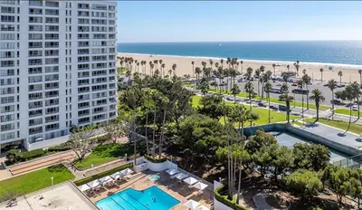 a view of the beach from the balcony of a resort at Santa Monica Ocenfront 2 Bedroom Villa with Parking in Los Angeles
