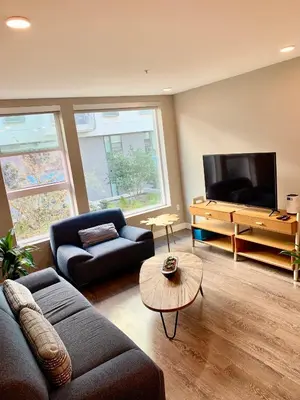 a living room with a couch and a tv at Contemporary 2BR Prime Hollywood Location in Los Angeles