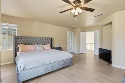 a bedroom with a bed and a ceiling fan at Spacious Mountain Getaway Game Room & Gazebo villa in Pine Mountain Club