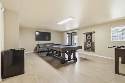 a room with a ping pong table and a tv at Spacious Mountain Getaway Game Room & Gazebo villa in Pine Mountain Club