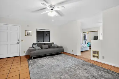 a living room with a couch and a ceiling fan at Spacious Mountain Getaway Game Room & Gazebo villa in Pine Mountain Club