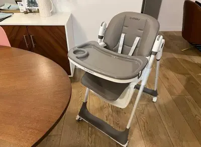 a high chair sitting next to a table at Huth Street Haven in Lake Isabella