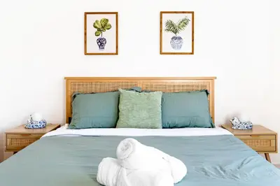 a bedroom with a bed with towels on it at Metro Loft LA in Los Angeles