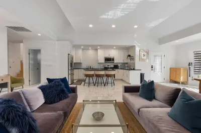 a living room with two couches and a kitchen at Serene Luxe Residence near Rose Bowl in Pasadena