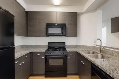 a kitchen with a stove and a sink at Modern 1BR Retreat in Marina del Rey - Pool, Hot Tub & Gym, Sauna in Los Angeles