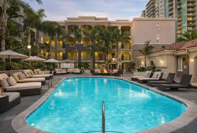 a swimming pool with lounge chairs and a hotel at Relaxed Marina del Rey Stay - 1BR with Pool, Sauna & Gym Access in Los Angeles