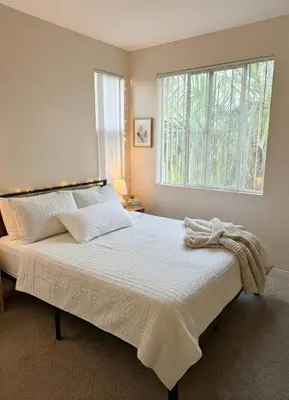 a bedroom with a large bed with a window at Marina Del Rey Apartment with Resort Amenities - Short Distance To Venice Beach in Los Angeles