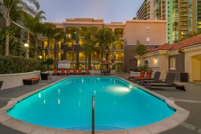 a large swimming pool in the middle of a building at Marina Del Rey Apartment with Resort Amenities - Short Distance To Venice Beach in Los Angeles