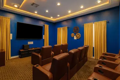 a cinema room with chairs and a flat screen tv at Marina Del Rey Apartment with Resort Amenities - Short Distance To Venice Beach in Los Angeles