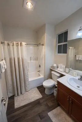 a bathroom with a toilet and a shower and a sink at Marina Del Rey 2BR & 1BR Getaway - Gym - Pool - Sauna - Near Marina - Venice Beach in Los Angeles