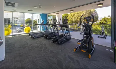 a gym with treadmills and elliptical machines at Santa Monica 3BD Serenity Suite with FREE PARKING in Los Angeles