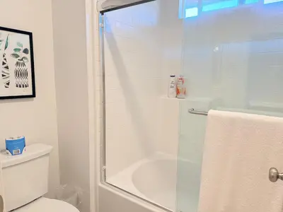 a bathroom with a shower and a toilet at Modern Luxury House 3B&4B House 30 mins DTLA in Baldwin Park
