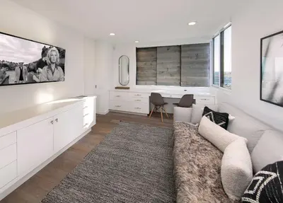 a living room with a couch and a tv at Rincon Refuge - Beachfront for 6 in Ventura