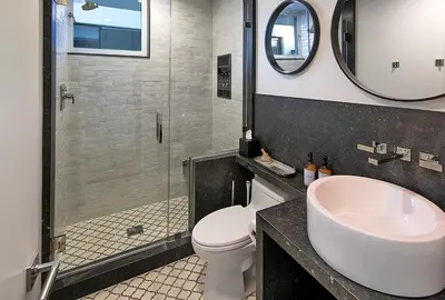 a bathroom with a sink and a toilet and a shower at Rincon Refuge - Beachfront for 6 in Ventura