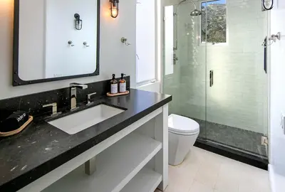 a bathroom with a sink and a shower at Rincon Refuge - Beachfront for 6 in Ventura