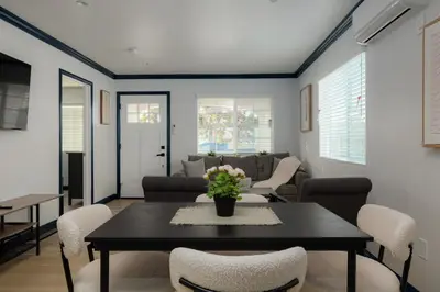 a living room with a table and chairs at Pet-Friendly 2BR-2BA Near SoFi-Small Dogs Welcome in Los Angeles