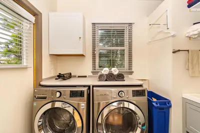 a kitchen with two washer and dryer at The SOFI Special - Modern Retreat, Dog Friendly in Los Angeles