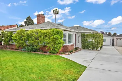 a house with a lawn and a driveway at The SOFI Special - Modern Retreat, Dog Friendly in Los Angeles