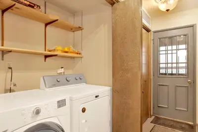 a laundry room with a white washing machine at Summit Ski and Bike Trails #2574 in Big Bear Lake