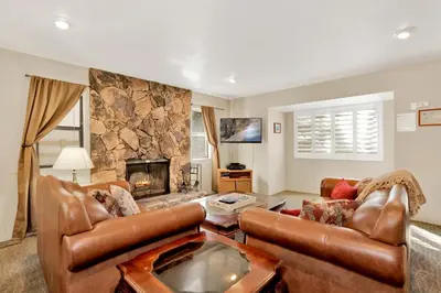 a living room with a couch and a fireplace at Summit Ski and Bike Trails #2574 in Big Bear Lake
