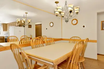 a kitchen and dining room with a table and chairs at Summit Ski and Bike Trails #2574 in Big Bear Lake