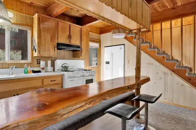 a kitchen with a wooden counter top and a staircase at Slope Side Getaway #2526 in Big Bear Lake