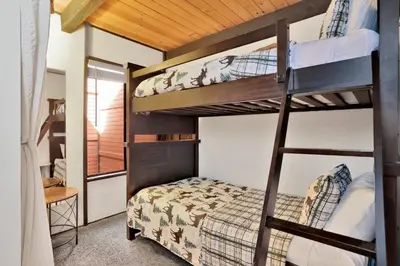 a bedroom with bunk beds in a house at Switzerland Summit Condo #2569 in Big Bear Lake