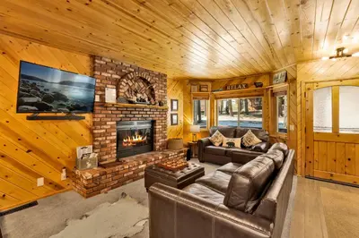a living room with a couch and a fireplace at Golden West Cottage #2581 in Big Bear Lake