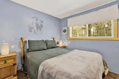 a bedroom with a bed and a window at Arlberg Village Haus #2571 in Big Bear Lake