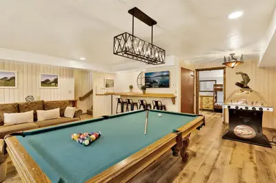 a living room with a pool table at Arlberg Village Haus #2571 in Big Bear Lake