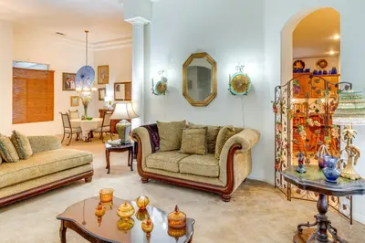 a living room with two couches and a table at 5 Mi to the Marketplace Roomy Bakersfield Retreat in Bakersfield
