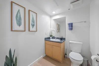 a bathroom with a toilet and a sink at Waterfront Penthouse - Marina Views - Rooftop in Los Angeles