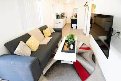 a living room with a couch and a table at Cozy 2 Bedroom In Hollwood area Close to Downtown La in Los Angeles