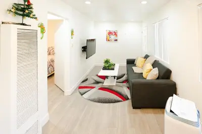 a living room with a couch and a table at Cozy 2 Bedroom In Hollwood area Close to Downtown La in Los Angeles