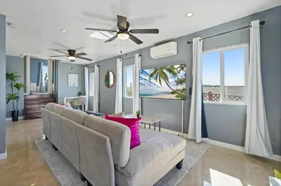 a living room with a couch and a ceiling fan at Darling 2 bedroom 1 bathroom Highland Park Home with Jacuzzi and View in Los Angeles