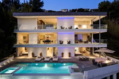 a house with a swimming pool in front of it at Stunning Hollywood Villa Pool and Panoramic Views in Los Angeles