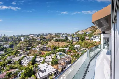 a glass balcony with a view of a city at Sunset Plaza Ultra Modern Home in Los Angeles